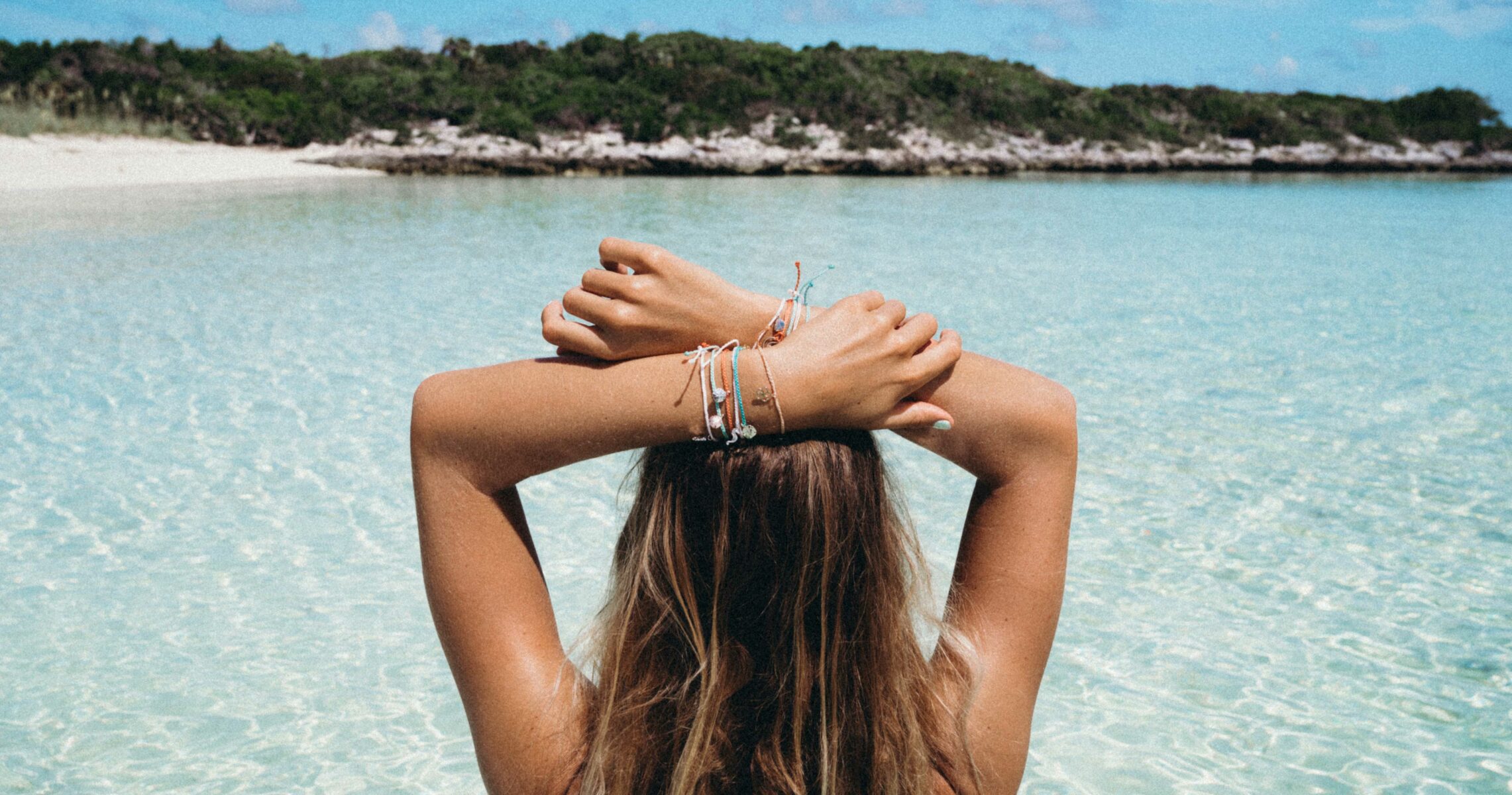 sage_pura_vida_hands_over_head_hero